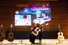 Classical guitarist María Esther Guzmán performing on one of the finalist classical guitars