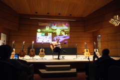 Flamenco guitarist Paco Serrano demonstrating one of the finalist flamenco guitars