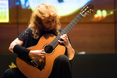 Classical guitarist María Esther Guzmán performing on one of the finalist classical guitars