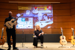 Alberto Cuéllar and María Esther Guzmán introducing one of the finalist classical guitars