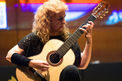 Classical guitarist María Esther Guzmán performing on one of the finalist classical guitars