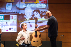 Alberto Cuéllar and Paco Serrano introducing one of the finalist flamenco guitars