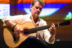 Flamenco guitarist Paco Serrano demonstrating one of the finalist flamenco guitars