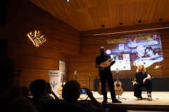 Alberto Cuéllar and María Esther Guzmán introducing one of the finalist classical guitars
