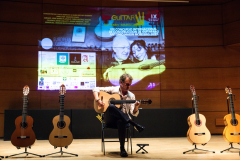 Flamenco guitarist Paco Serrano demonstrating one of the finalist flamenco guitars