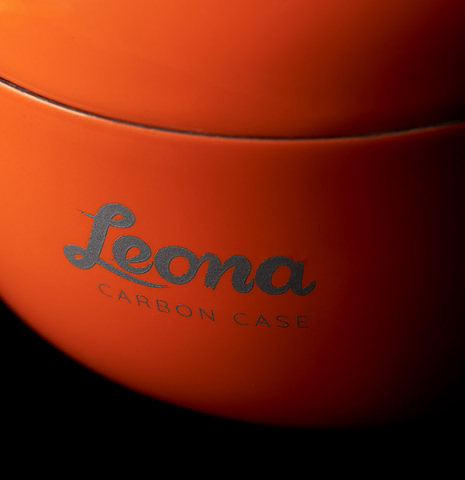 The logo on a “Luthier Series Carbon Case” by Leona Cases - Orange