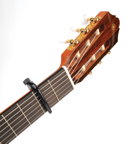 side profile of D'addario classical capo lite in use