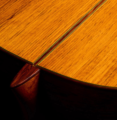 The heel, back binding and purfling of a 1974 Marcelino Lopez classical guitar made of cedar and CSA rosewood