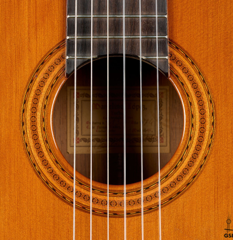 The rosette of a 1974 Marcelino Lopez classical guitar made of cedar and CSA rosewood