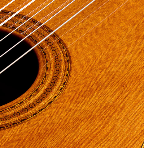 The soundboard and rosette of a 1974 Marcelino Lopez classical guitar made of cedar and CSA rosewood