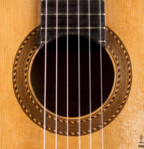 The rosette of a 1943 Miguel Gonzalez Abad classical guitar made of spruce and cypress