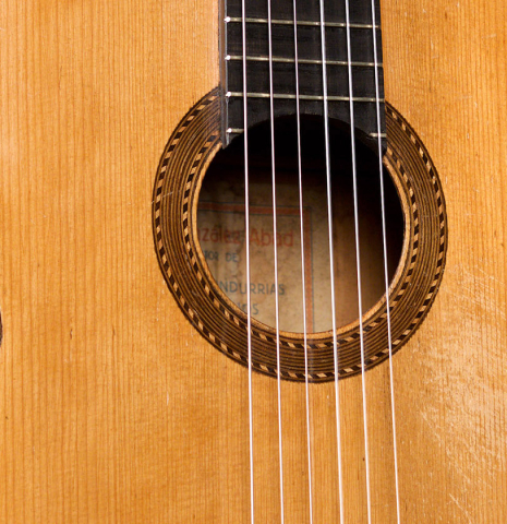 The soundboard of a 1943 Miguel Gonzalez Abad classical guitar made of spruce and cypress