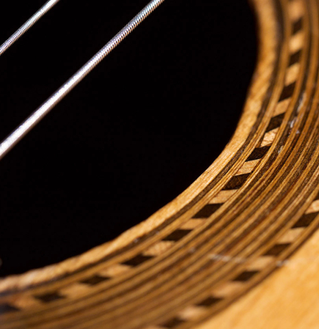 Close-up of the rosette of a 1943 Miguel Gonzalez Abad classical guitar made of spruce and cypress