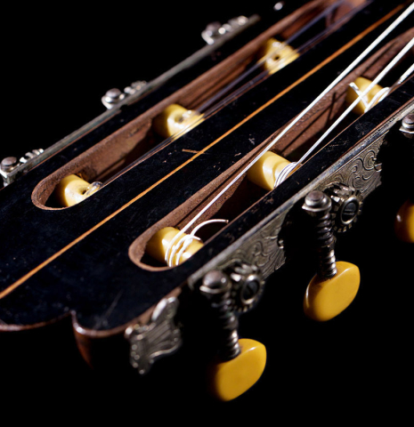 The headstock and tuning machines of a 1943 Miguel Gonzalez Abad classical guitar made of spruce and cypress
