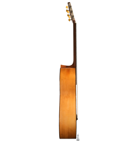 The side of a 1943 Miguel Gonzalez Abad classical guitar made of spruce and cypress