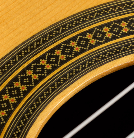 Close-up detail of the rosette of a 1996 Sergio Abreu classical guitar made of spruce and Indian rosewood