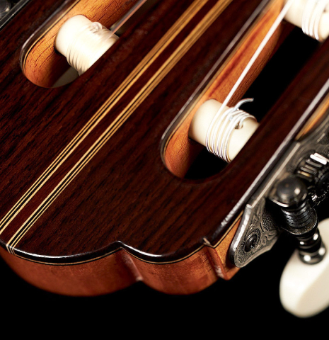 The headstock and tuning machines of a 2023 Manuel Adalid "Hauser" classical guitar made of spruce and Indian rosewood