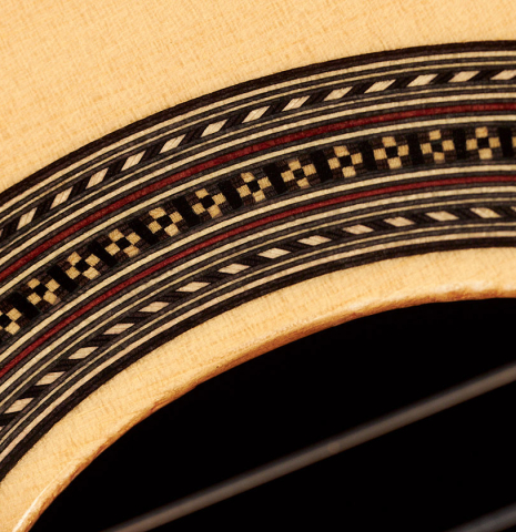 Closeup of the rosette of a 2023 Manuel Adalid "Hauser" classical guitar made of spruce and Indian rosewood