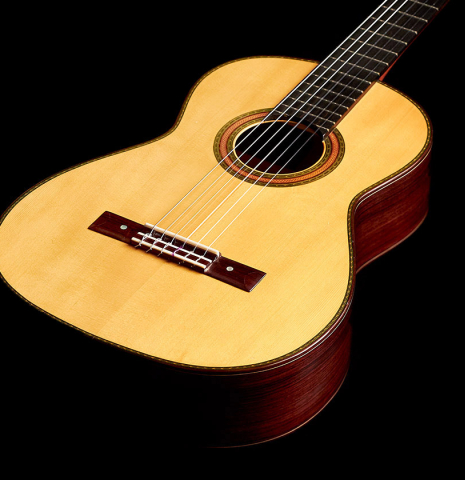 The front of a 2015 Manuel Adalid "Torres" classical guitar made of spruce and Indian rosewood
