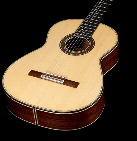 The top and sides of a 2023 Colin van Aelbrouck classical guitar made of spruce and Indian rosewood