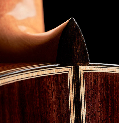 The back, heel, binding and purfling of a 2023 Colin van Aelbrouck classical guitar made of spruce and Indian rosewood