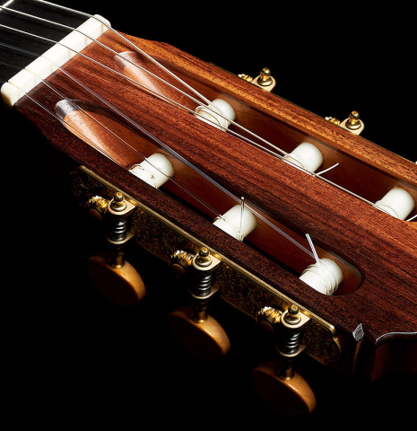 The headstock and tuning machines of a 2023 Colin van Aelbrouck flamenco guitar made of spruce and cypress