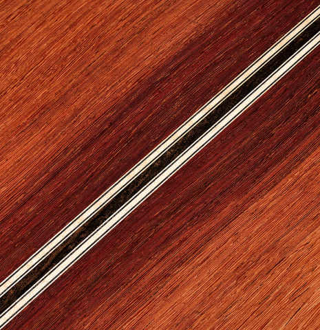 The back center seam of a 2025 Colin van Aelbrouck classical guitar made of spruce and African rosewood