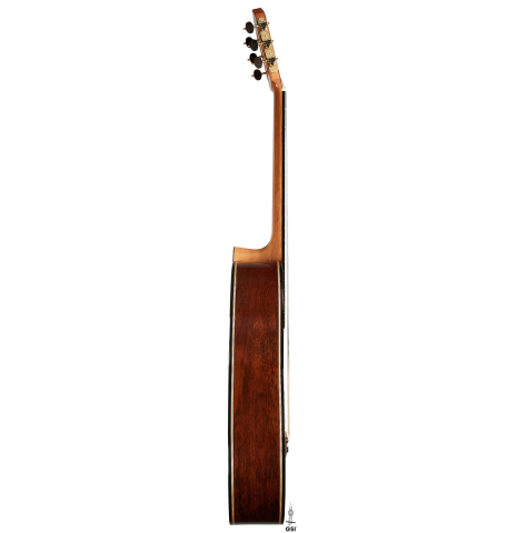 The side of a 2025 Colin van Aelbrouck classical guitar made of spruce and African rosewood