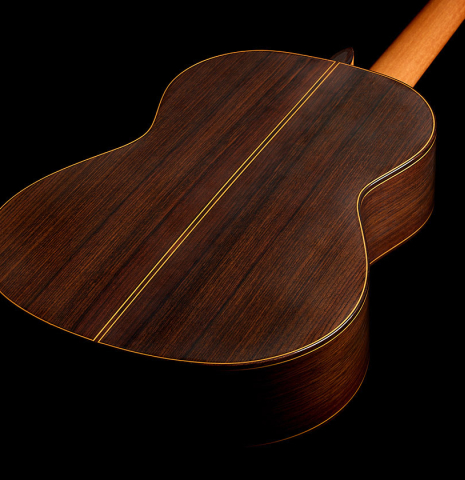 The back and sides of a 2021 Alhambra “Mengual y Margarit NT” classical guitar made of cedar and Indian rosewood