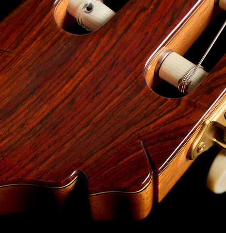 The headstock and tuning machines of a 2021 Alhambra “Mengual y Margarit NT” classical guitar made of cedar and Indian rosewood