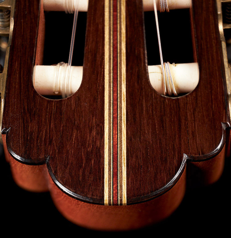 The headstock of a 2002 Simon Ambridge classical guitar made with spruce and CSA rosewood.