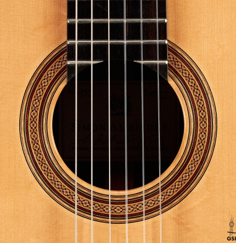 The rosette of a 2002 Simon Ambridge classical guitar made with spruce and CSA rosewood.