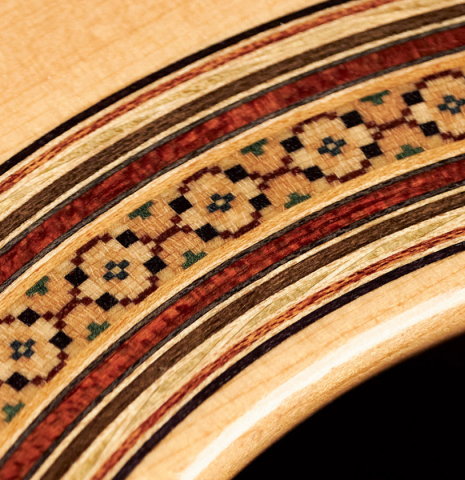 The rosette of a 2002 Simon Ambridge classical guitar made with spruce and CSA rosewood.
