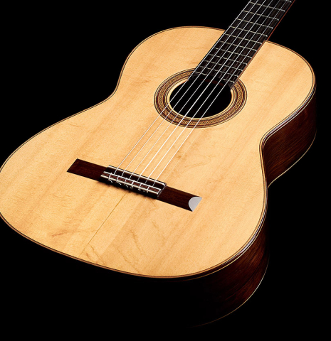 The front of a 2002 Simon Ambridge classical guitar made with spruce and CSA rosewood.