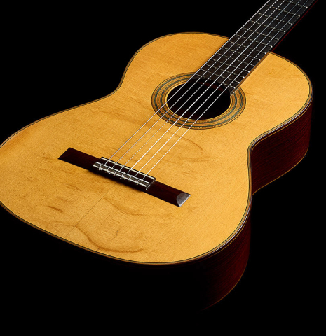 The soundboard and sides of a 2000 Simon Ambridge classical guitar made with spruce and Indian rosewood