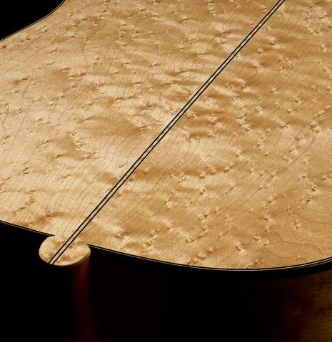 The heel, back binding and purfling of a 2008 Simon Ambridge "1887 Torres SE 111" classical guitar made of spruce and maple