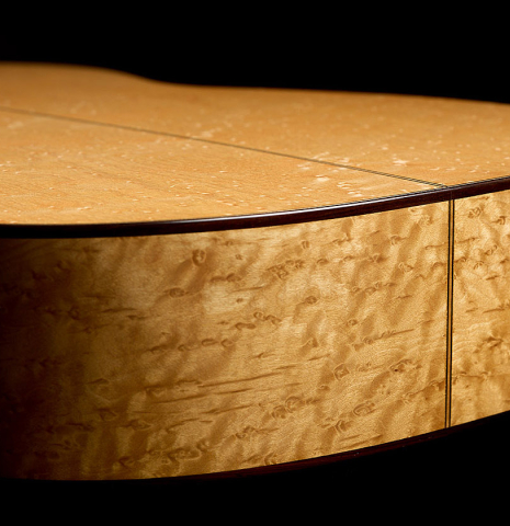 The back and sides at the foot of a 2008 Simon Ambridge "1887 Torres SE 111" classical guitar made of spruce and maple