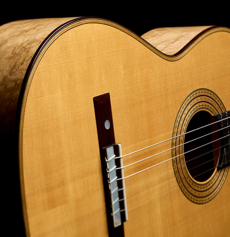 The top and sides of a 2008 Simon Ambridge "1887 Torres SE 111" classical guitar made of spruce and maple