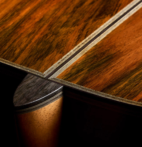 The heel, back binding and purfling of a 2026 Ariel Ameijenda "70th Anniversary" classical guitar made of alerce and CSA rosewood
