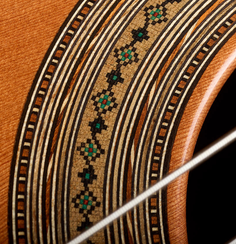 Detailed close-up of the rosette of a 2026 Ariel Ameijenda "70th Anniversary" classical guitar made of alerce and CSA rosewood