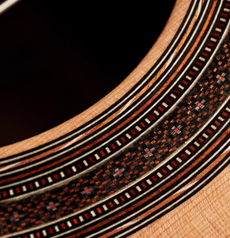 The rosette of a 2023 Ariel Ameijenda &quot;Confessional&quot; classical guitar made of cedar and Uruguayan blackwood