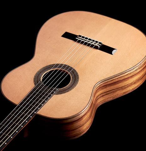 The soundboard of a 2023 Ariel Ameijenda &quot;Confessional&quot; classical guitar made of cedar and Uruguayan blackwood