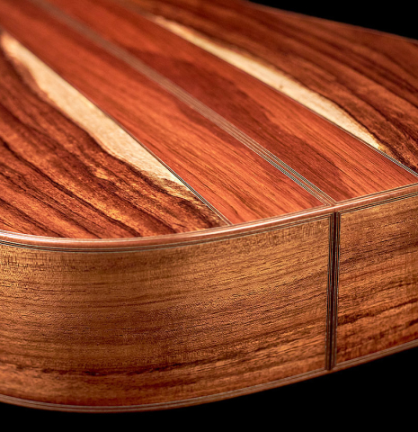 This is a close-up shot of the back and sides of a 2022 Ariel Ameijenda "Confessional" AL/BL classical guitar
