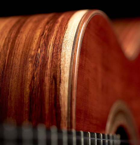 This is a close-up shot showing the sides and top of a 2022 Ariel Ameijenda "Confessional" AL/BL classical guitar