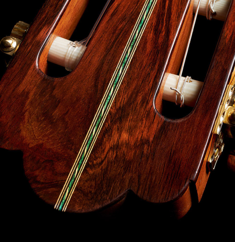 The headstock veneer and purfling of a 2024 Ariel Ameijenda "1885 Torres - SE 51" classical guitar made of spruce and CSA rosewood