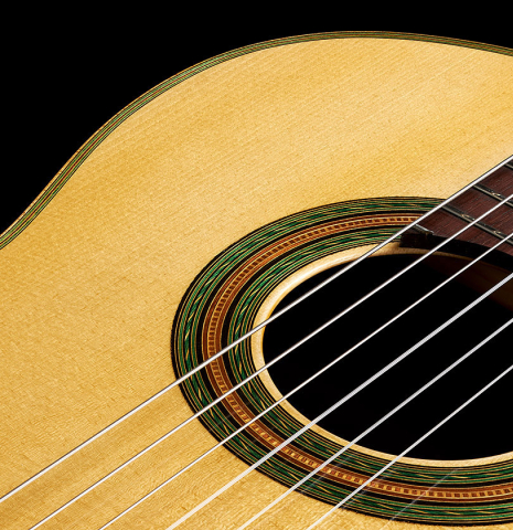 The soundboard of a 2024 Ariel Ameijenda "1885 Torres - SE 51" classical guitar made of spruce and CSA rosewood