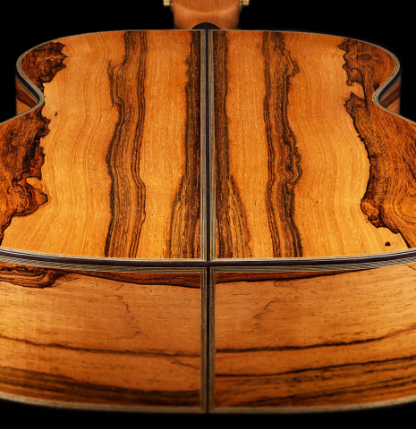 The back and sides at the foot of a 2025 Ariel Ameijenda classical guitar made of cedar and CSA rosewood