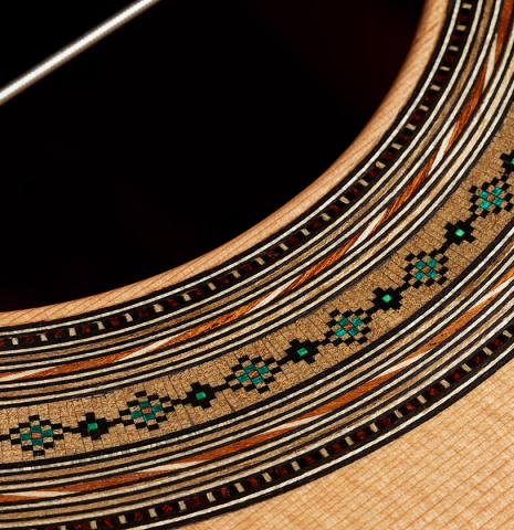 Detailed close-up of the rosette of a 2025 Ariel Ameijenda classical guitar made of cedar and CSA rosewood