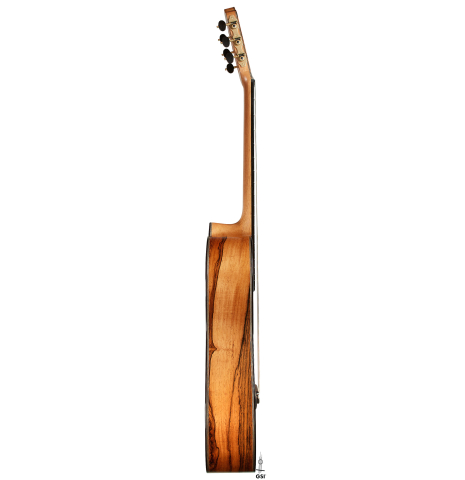 The side of a 2025 Ariel Ameijenda classical guitar made of cedar and CSA rosewood