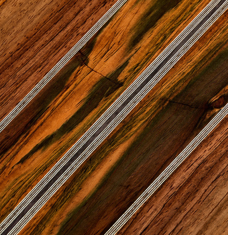 The four-piece back of a 2025 Ariel Ameijenda "70th Anniversary - Lightning Strikes" classical guitar made of cedar and CSA rosewood